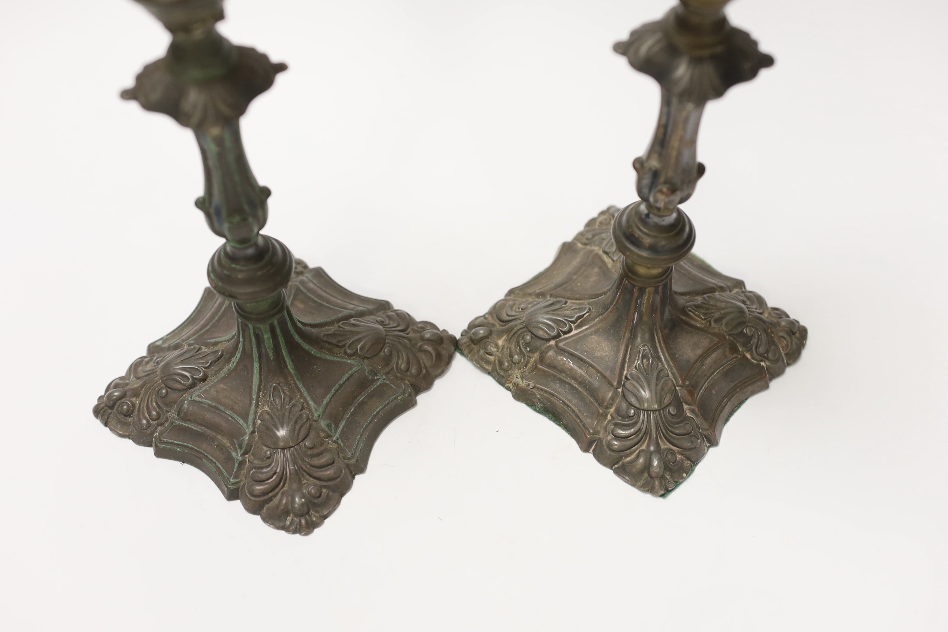 A pair of late 18th century Old Sheffield plate candlesticks, 24cm high